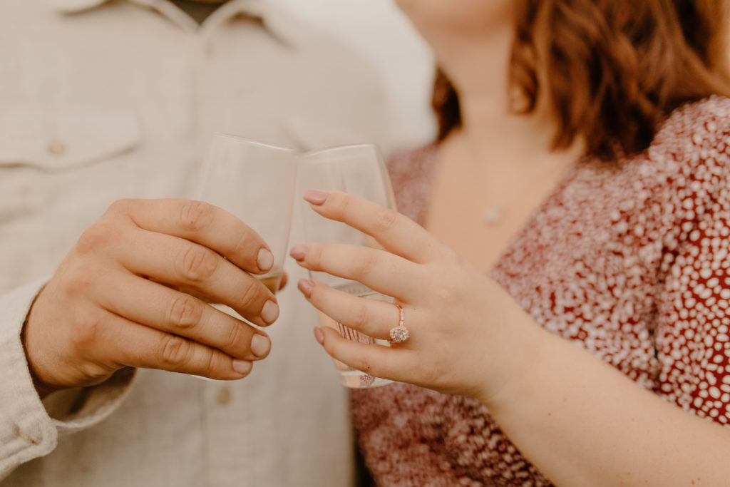 close up shot of man and woman holding champagne glasses