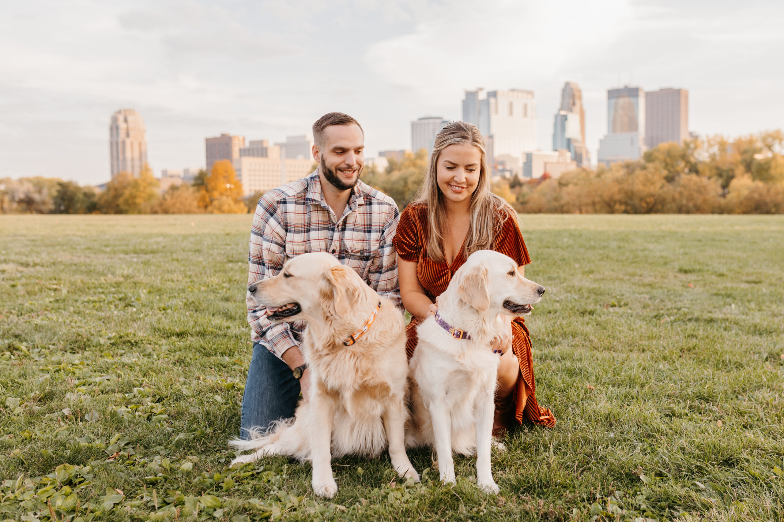 couple playing with their dogs in downtown Minneapolis