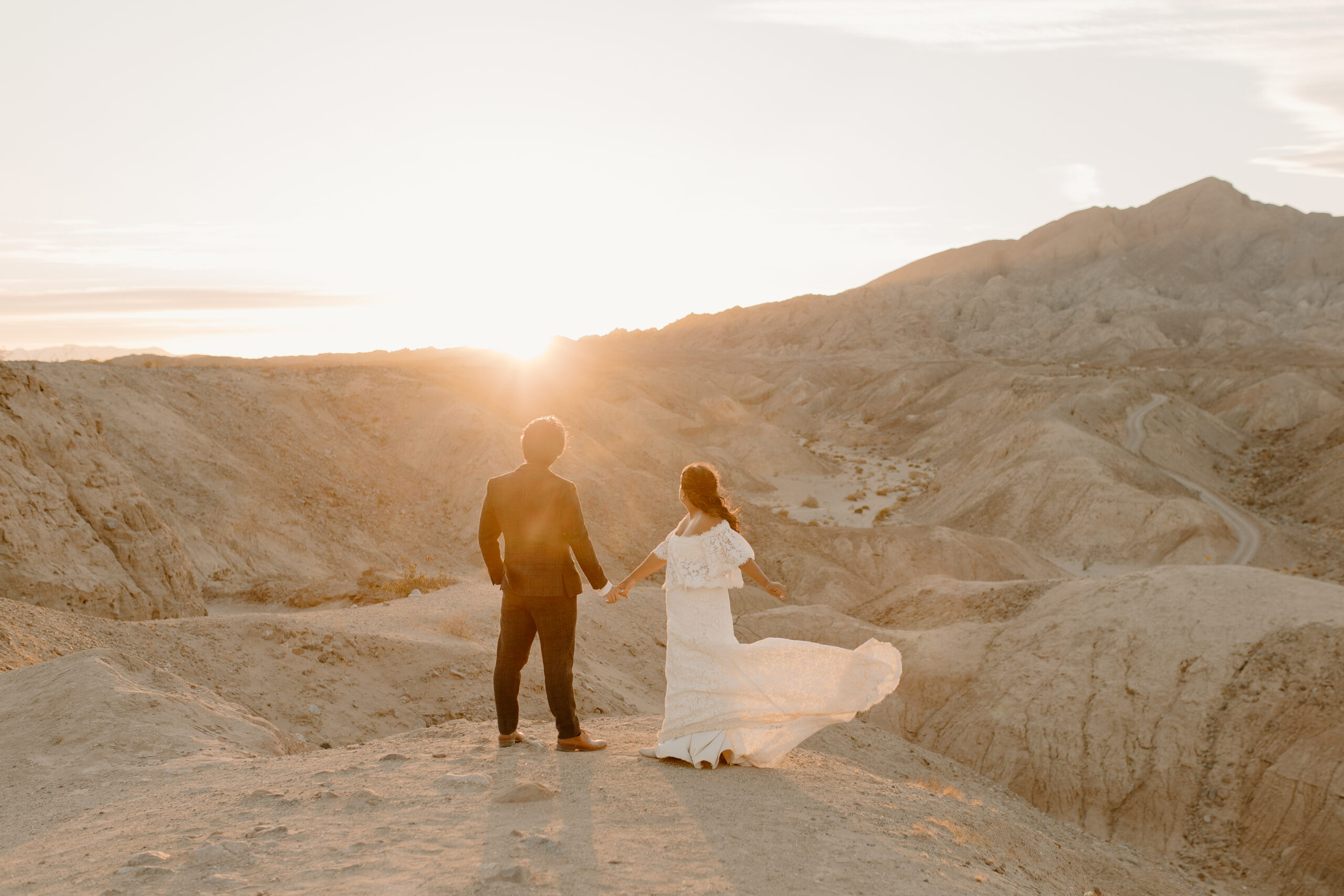 bride and groom taking in the sunset at their California desert elopement